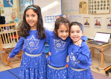 CJDS elementary school girls in blue dresses